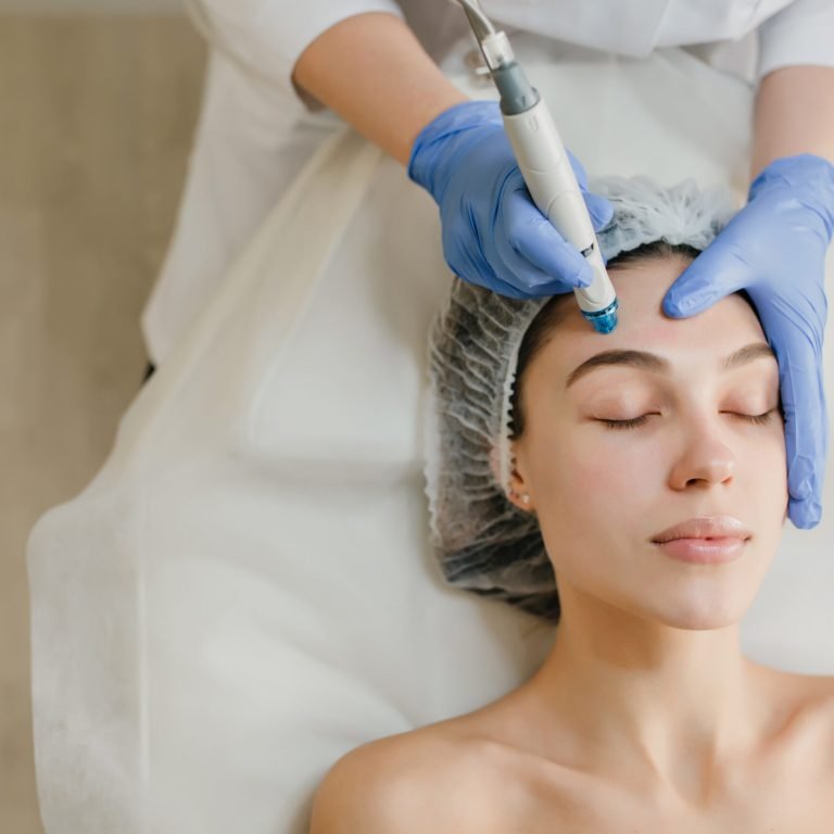 View from above of beautiful woman enjoying cosmetology procedures, rejuvenation in beauty salon. Dermatology, doctor at work, healthcare, therapy, botox. Place for text